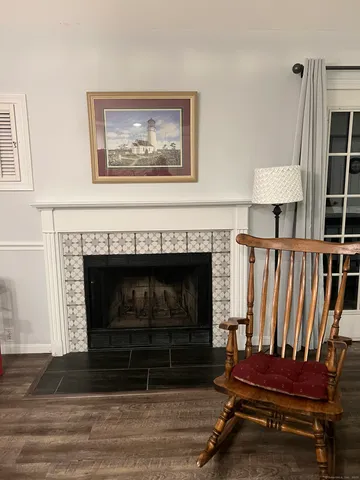 a view of livingroom with furniture and a fireplace