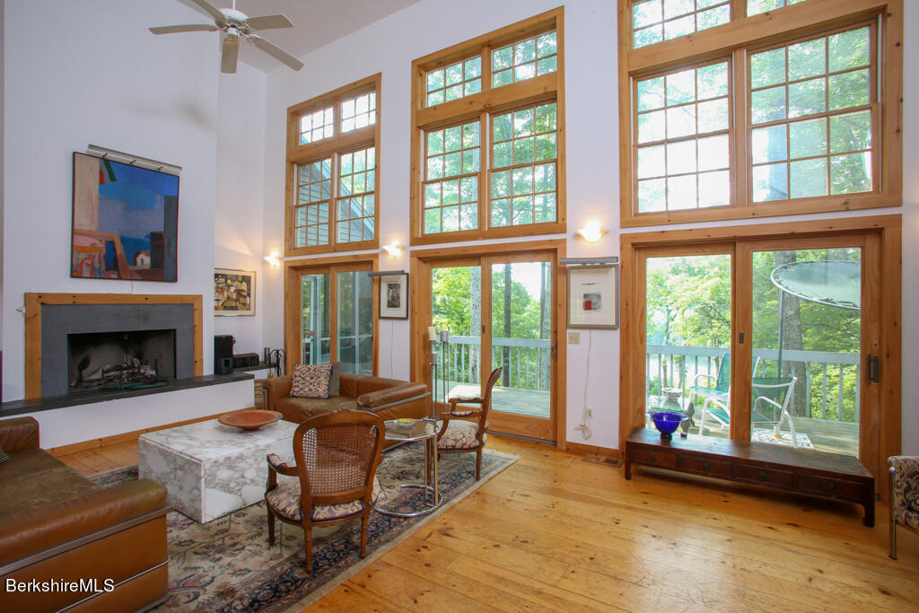 142 Main Road Monterey, MA 01230 - Photo 2 of 32 a living room with furniture and a fireplace