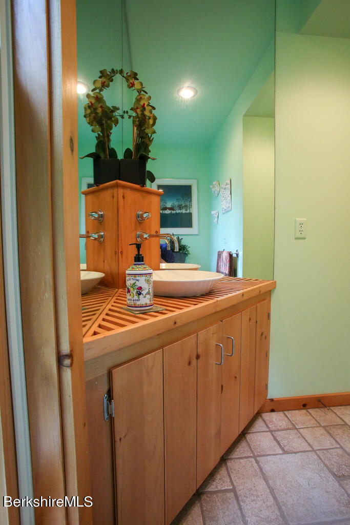 142 Main Road Monterey, MA 01230 - Photo 30 of 32 a bathroom with a sink and a mirror