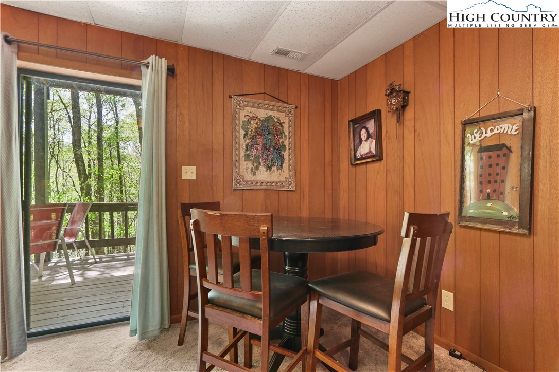 845 Trout Lake Road Deep Gap, NC 28618 - Photo 20 of 38 a dining room with furniture and window