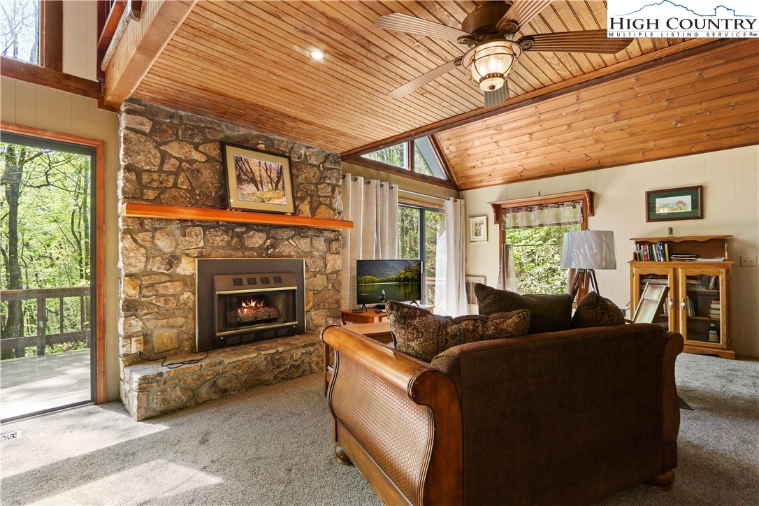 845 Trout Lake Road Deep Gap, NC 28618 - Photo 3 of 38 a living room with furniture and a fireplace