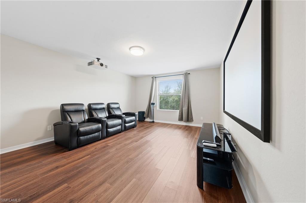 4228 Raffia Palm Circle Naples, FL 34119 - Photo 29 of 50 Home theater room featuring wood finished floors