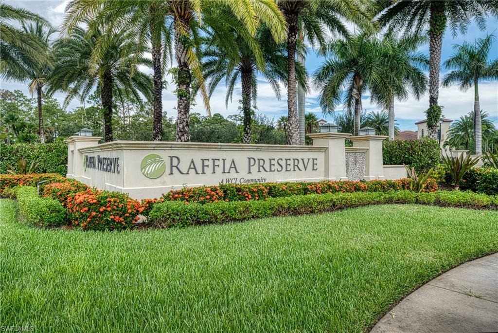 4228 Raffia Palm Circle Naples, FL 34119 - Photo 36 of 50 Community sign featuring a yard