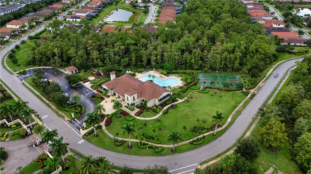 4228 Raffia Palm Circle Naples, FL 34119 - Photo 46 of 50 Aerial view of property and surrounding area with a pool and a large body of water