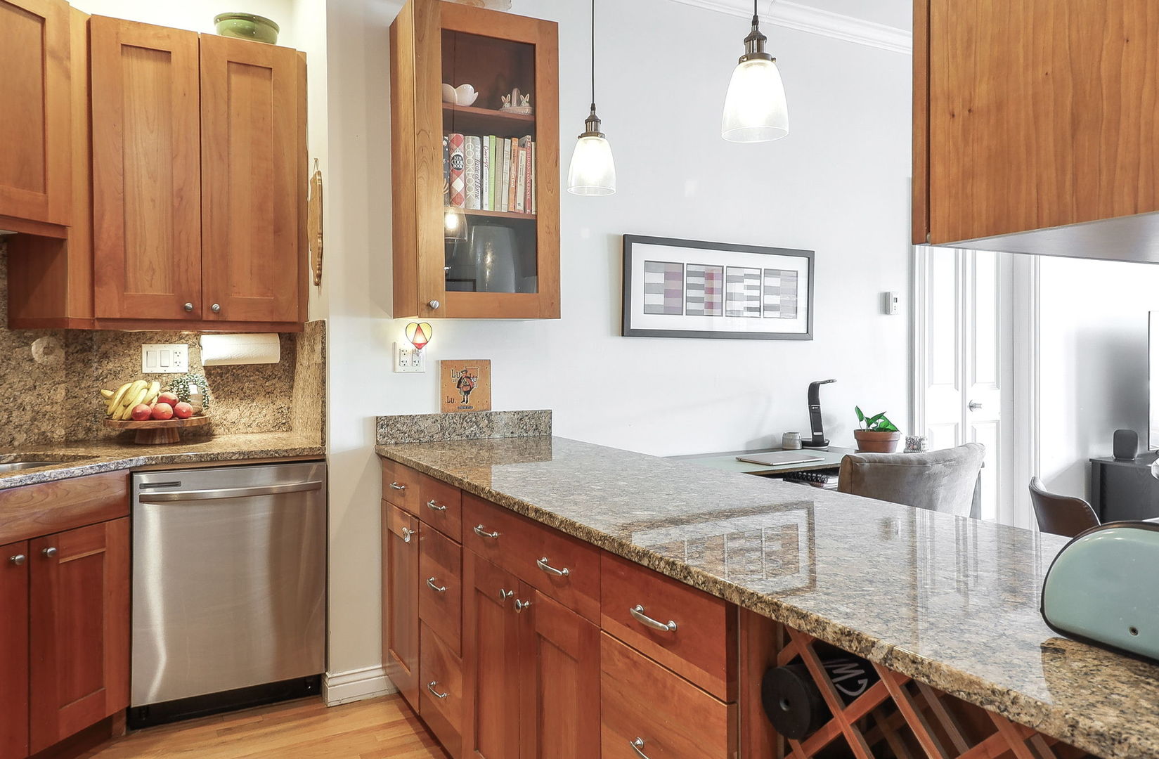 1355 West Washington Boulevard, Unit 4A Chicago, IL 60607 - Photo 7 of 24 a kitchen with granite countertop a sink a counter top space and cabinets