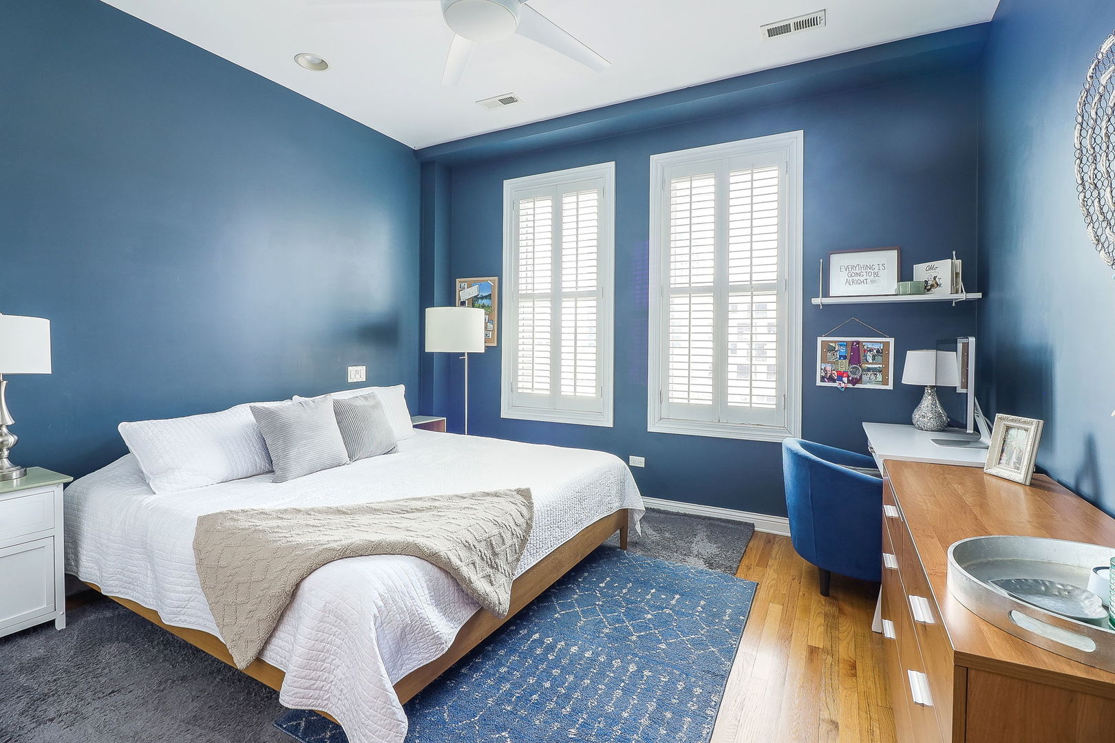 1355 West Washington Boulevard, Unit 4A Chicago, IL 60607 - Photo 8 of 24 a bedroom with a bed and wooden floor