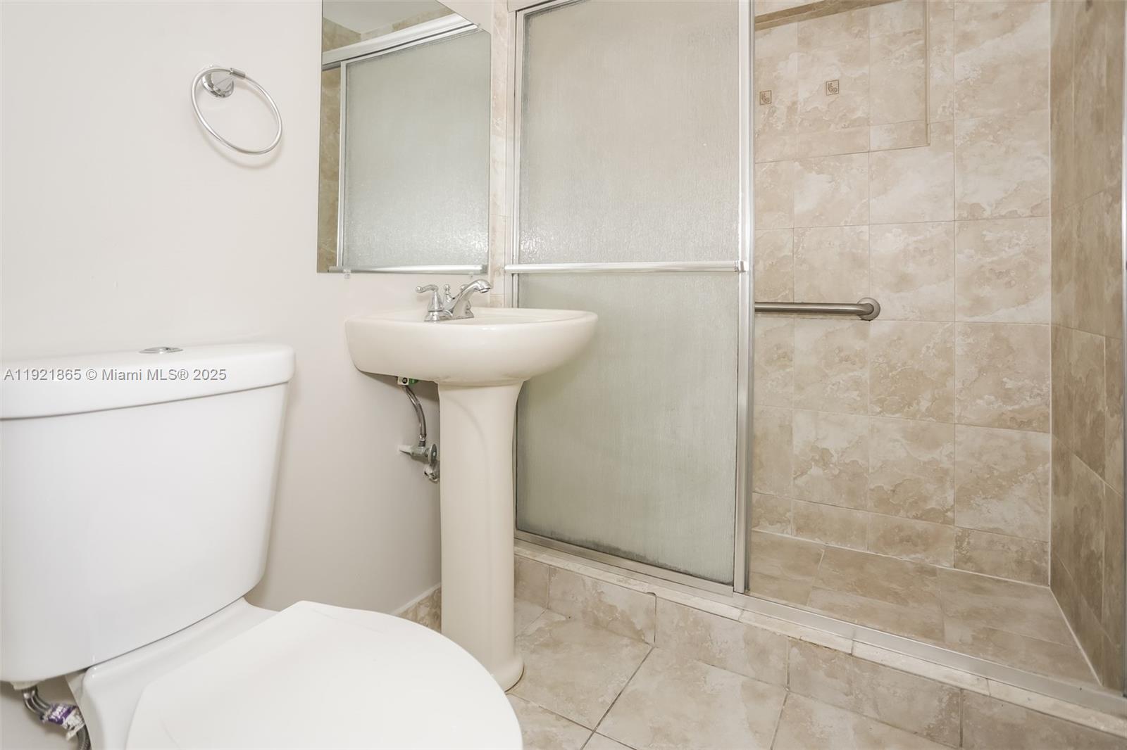 5835 Southwest 117th Avenue Miami, FL 33173 - Photo 13 of 16 a bathroom with a sink toilet and shower