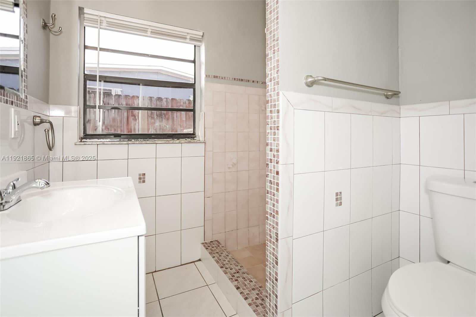 5835 Southwest 117th Avenue Miami, FL 33173 - Photo 14 of 16 a bathroom with a sink a toilet and shower