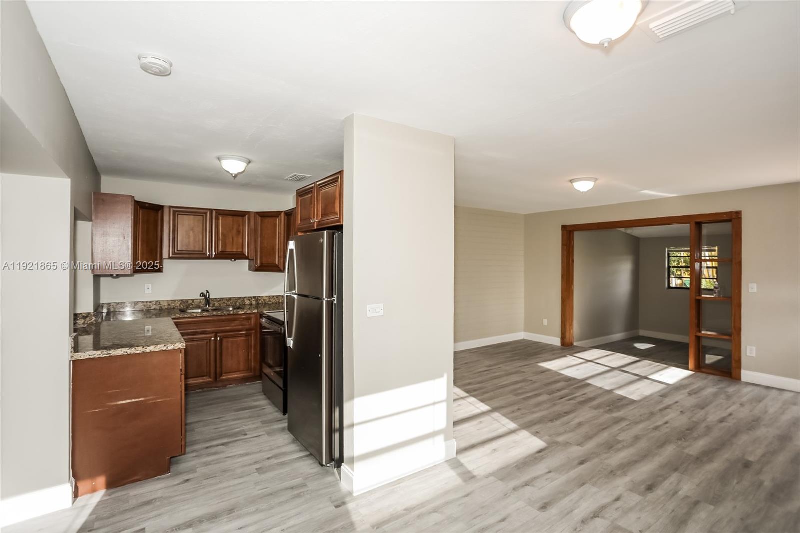 5835 Southwest 117th Avenue Miami, FL 33173 - Photo 5 of 16 a kitchen with stainless steel appliances granite countertop a refrigerator and a stove top oven