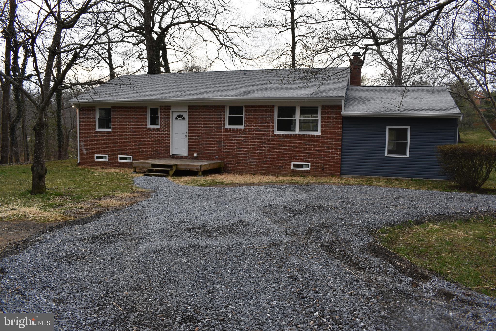 1401 Cape St Claire Road Annapolis, MD 21409 - Photo 6 of 26 Rear entrance and large gravel parking area