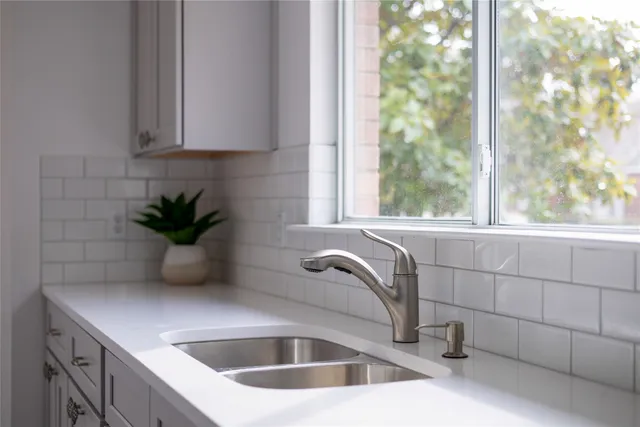 a bathroom with a sink and mirror