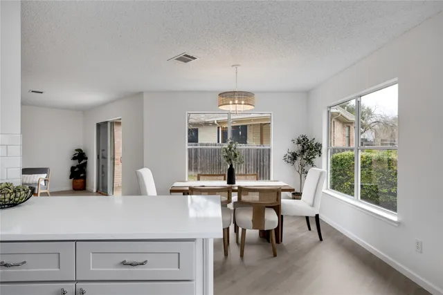 a view of a dining room with furniture window and outside view