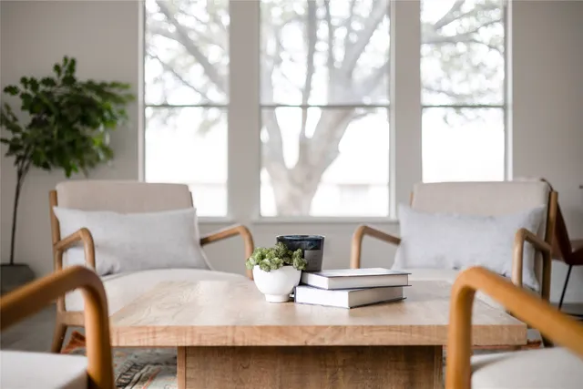 a dining room with furniture and window