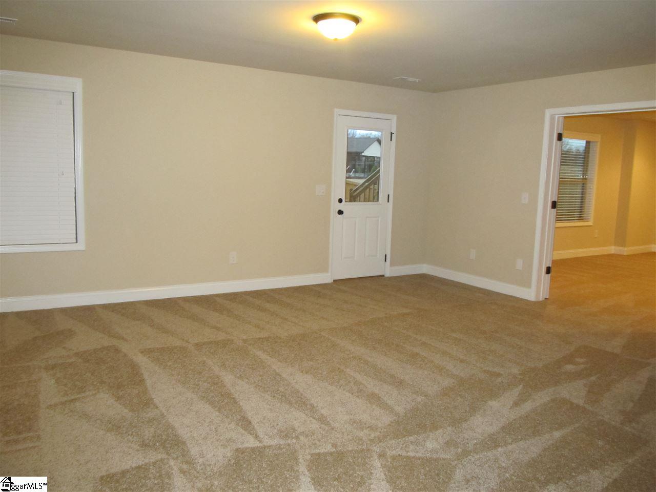 143 Sandpine Way Greer, SC 29651 - Photo 21 of 33 This could be used as in-law suite, has kitchenette, full bathroom, bedroom and living quarters.
