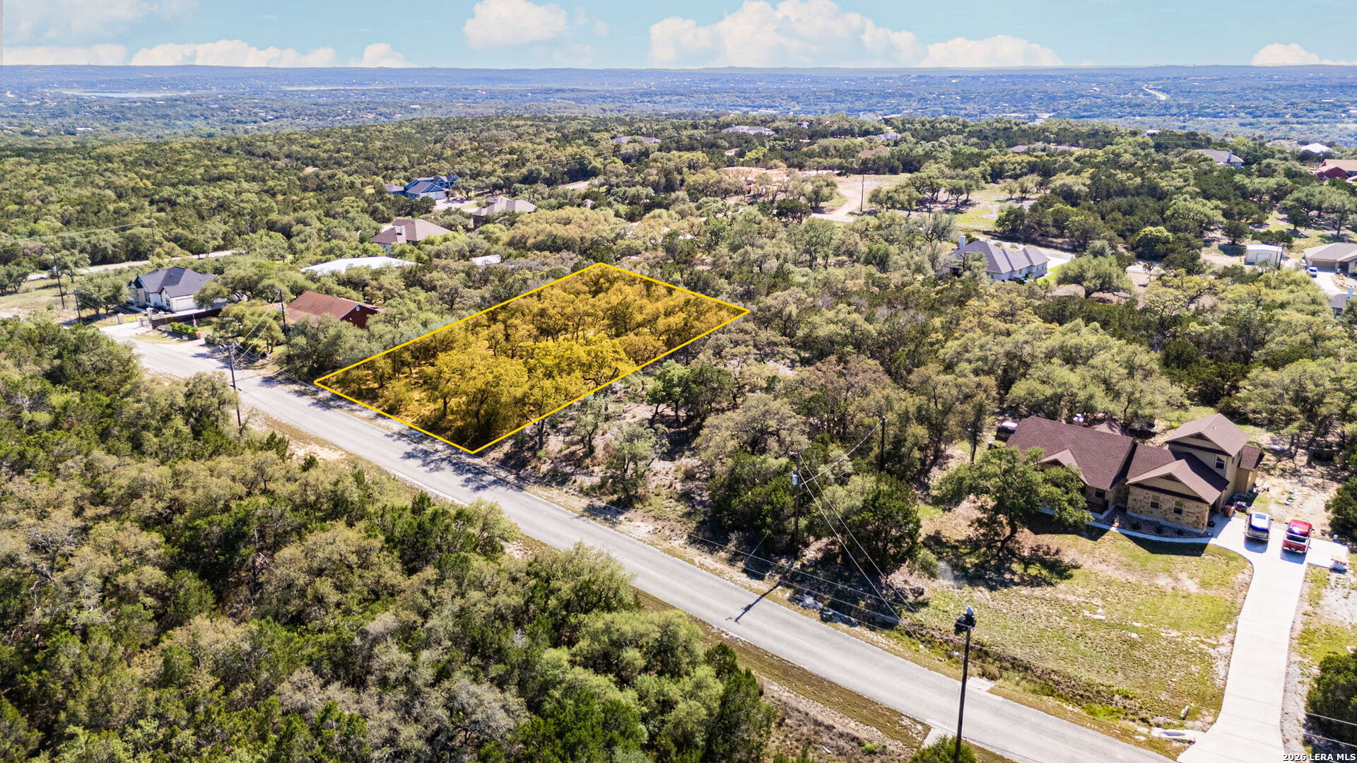 1158 Madrone Road Fischer, TX 78623 - Photo 8 of 8 a view of a city with a lake