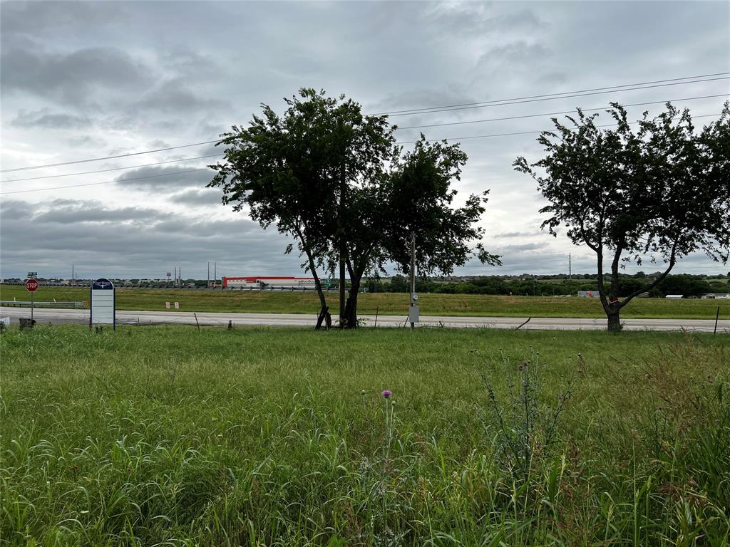 13501 Bates Aston Road Haslet, TX 76052 - Photo 2 of 4 a view of grassy field with benches and trees around