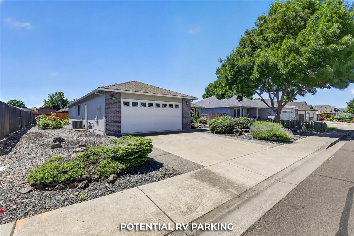 2618 Rabun Way Central Point, OR 97502 - Photo 4 of 42 a front view of a house with a yard and a garage