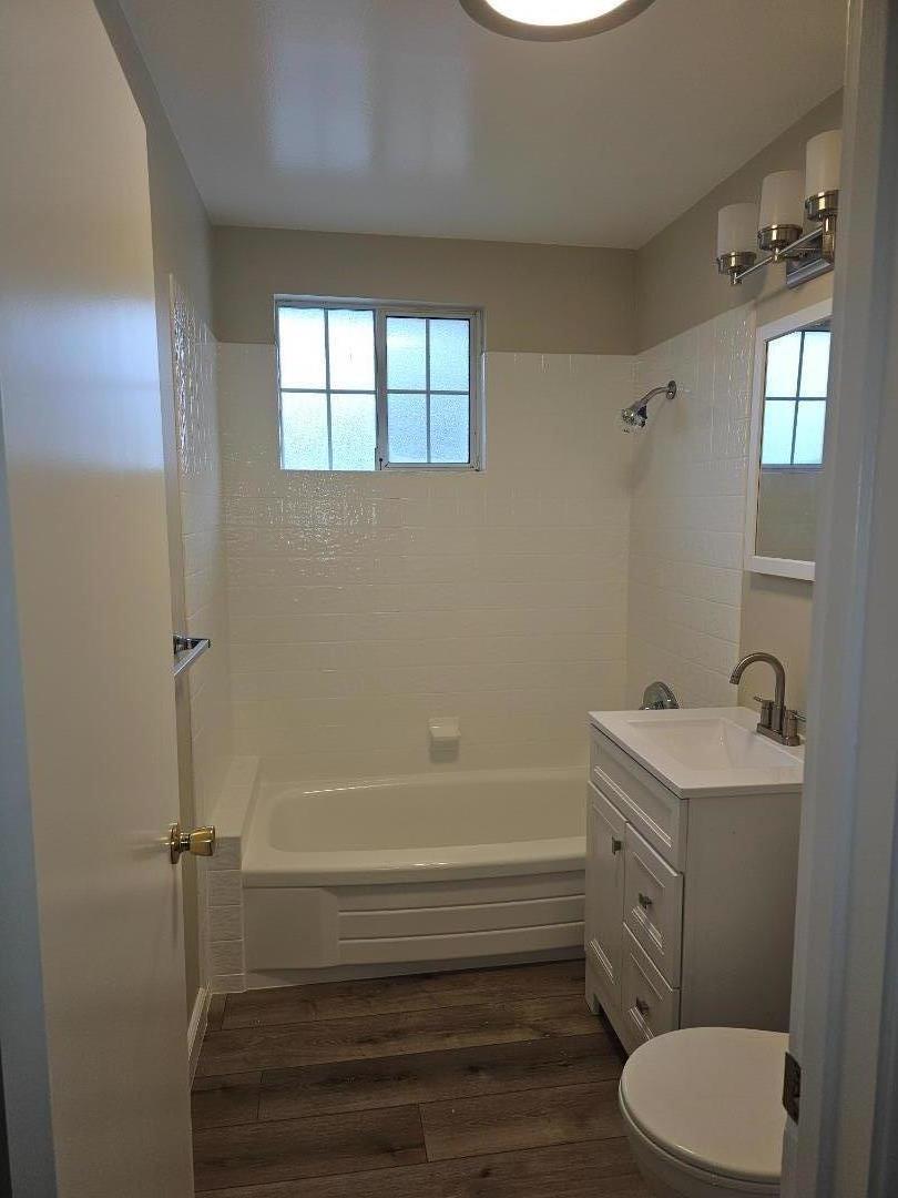 160 Clarendon Road, Unit A Pacifica, CA 94044 - Photo 12 of 13 a bathroom with a sink a toilet and shower