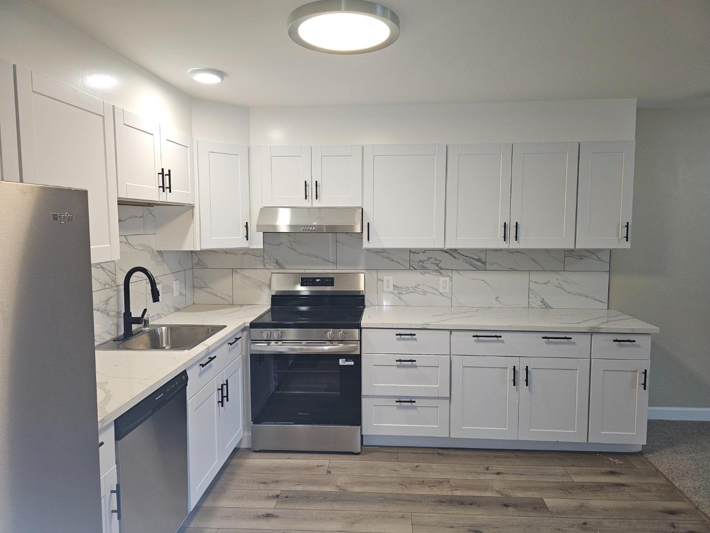 160 Clarendon Road, Unit A Pacifica, CA 94044 - Photo 2 of 13 a kitchen with a sink stove and cabinets