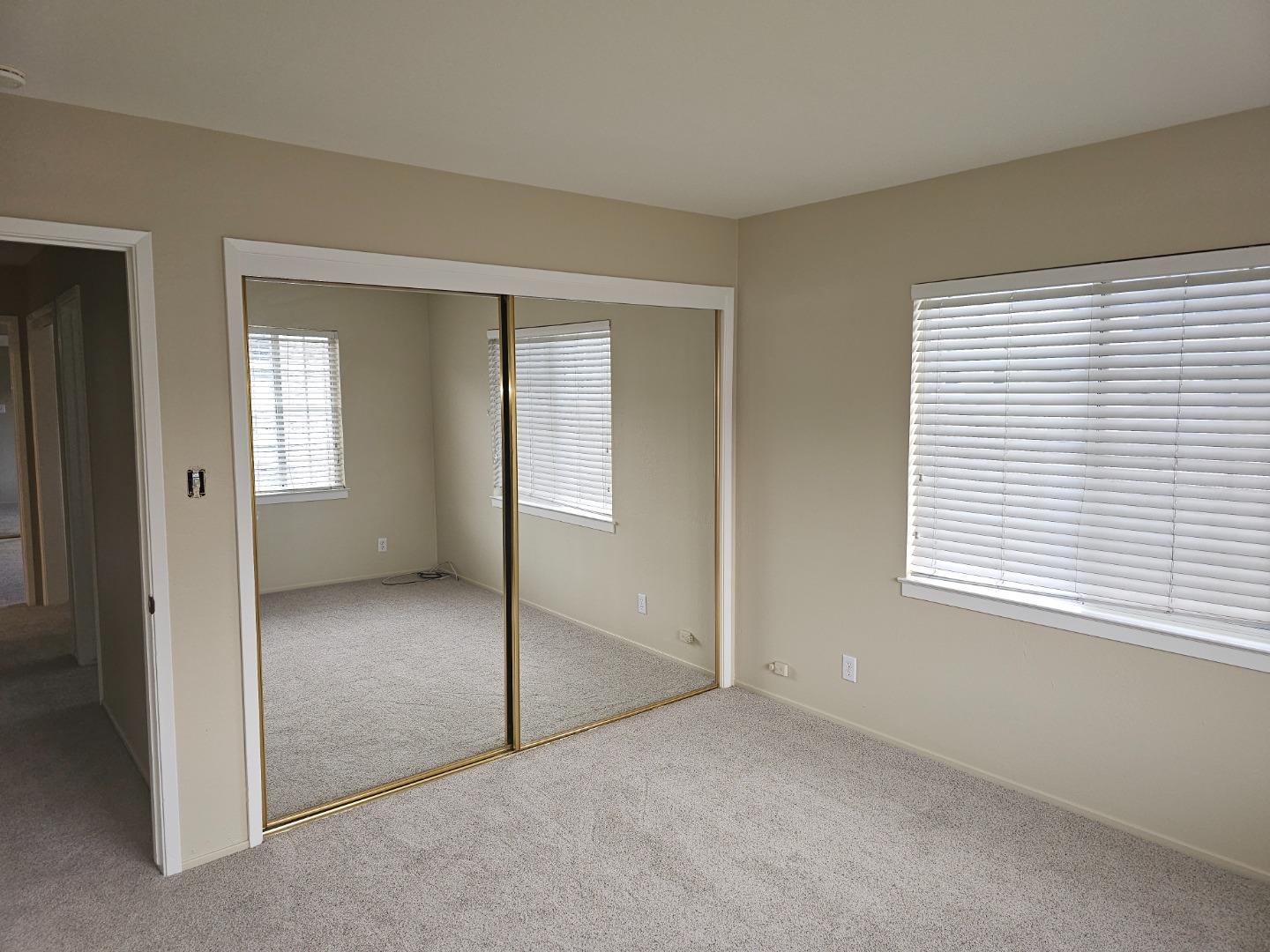 160 Clarendon Road, Unit A Pacifica, CA 94044 - Photo 10 of 13 an empty room that has a window
