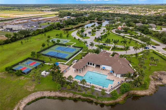 an aerial view of a houses with a lake view