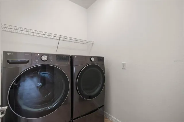 a utility room with dryer and washer