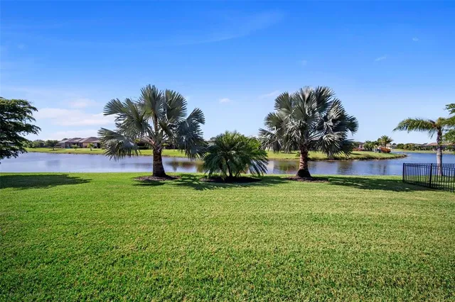 a view of a garden with a building in the background