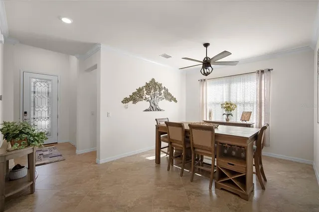 a dining room with furniture and window