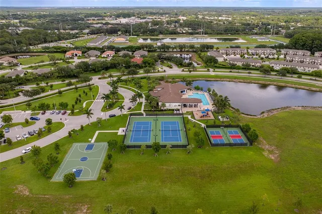 an aerial view of residential houses with outdoor space