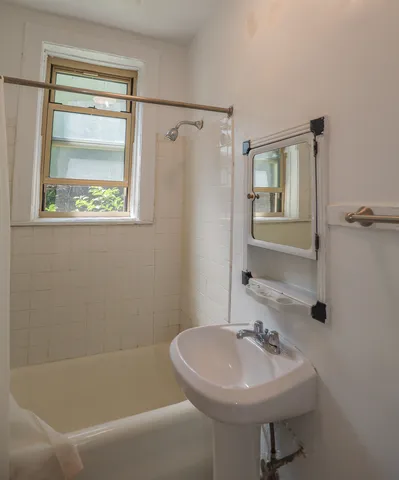 a bathroom with a sink a toilet and a bathtub
