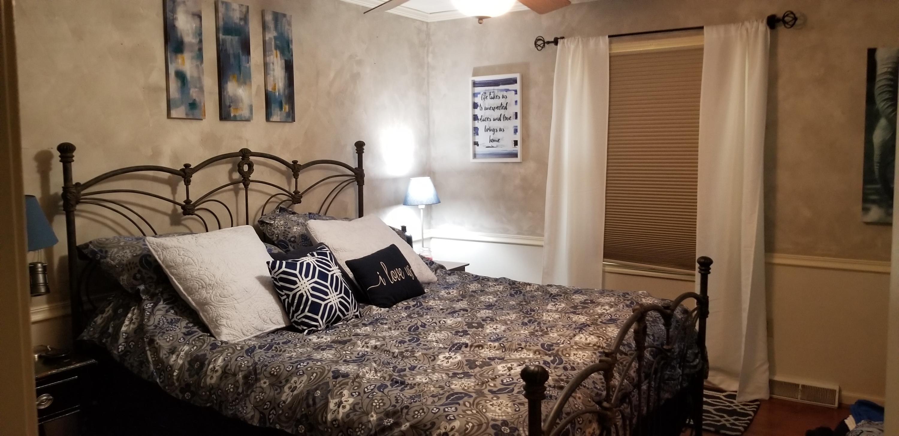1317 Chandler Road Goodview, VA 24095 - Photo 11 of 29 a bedroom with a bed and a dresser