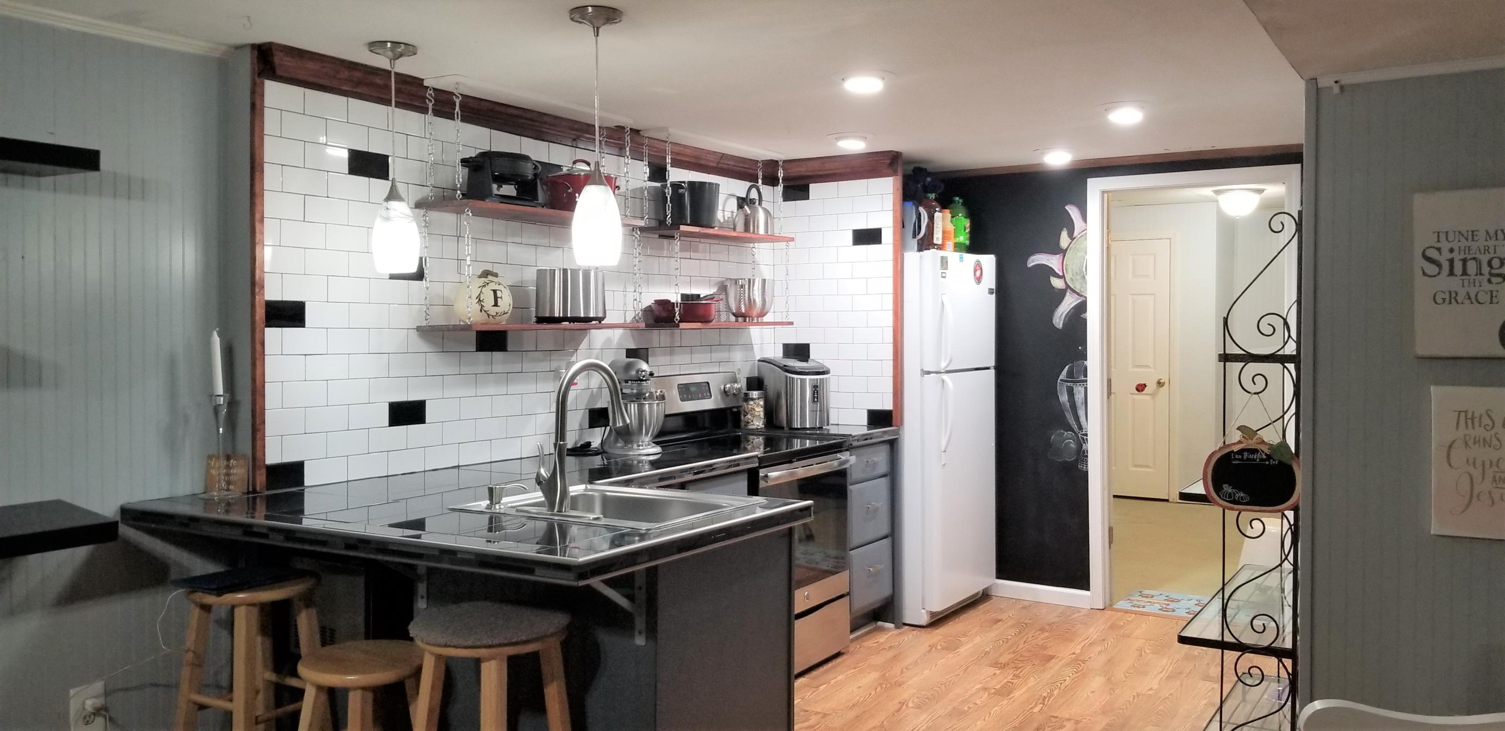 1317 Chandler Road Goodview, VA 24095 - Photo 18 of 29 a kitchen with refrigerator and cabinets
