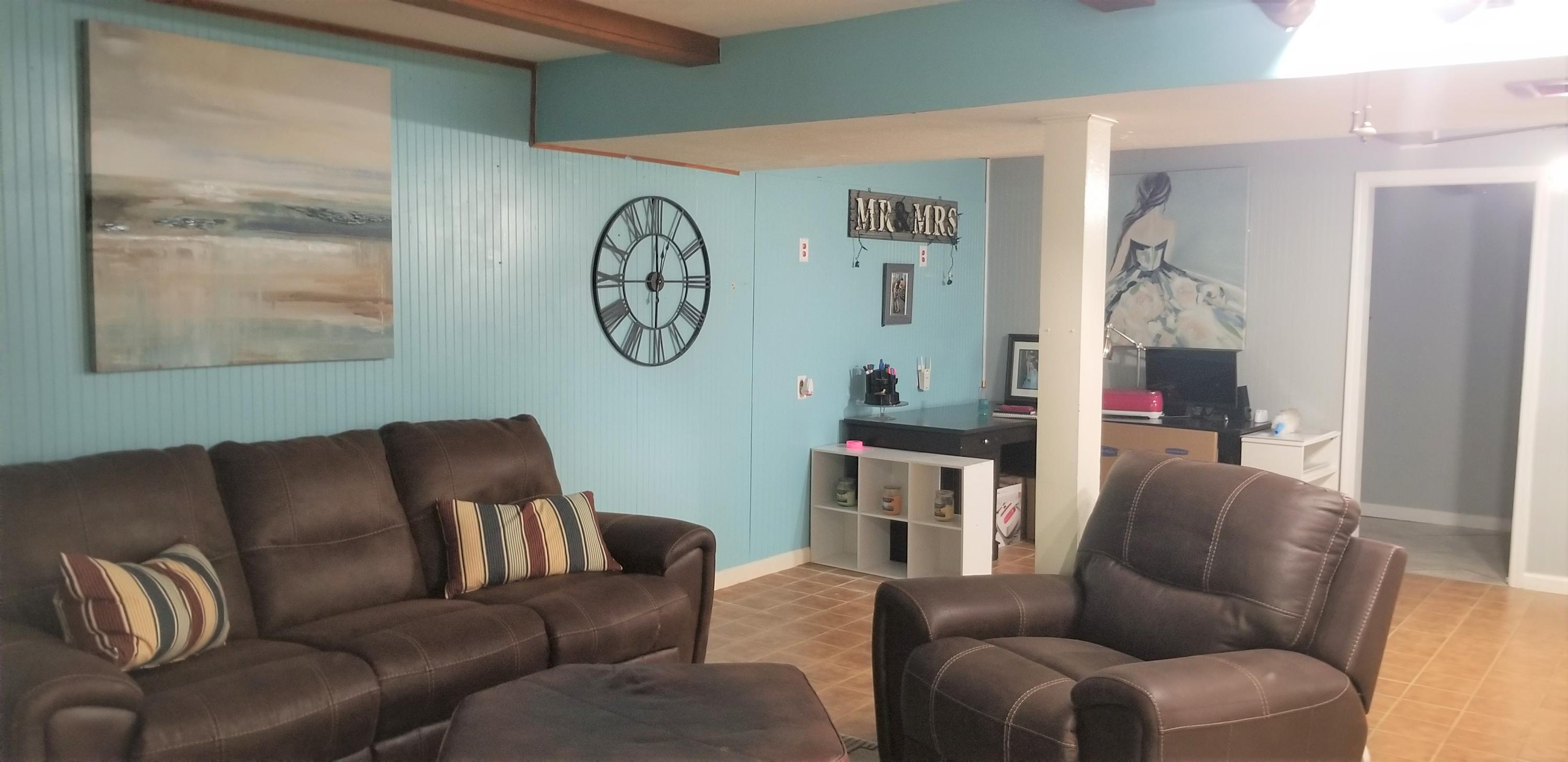 1317 Chandler Road Goodview, VA 24095 - Photo 19 of 29 a living room with furniture and a window