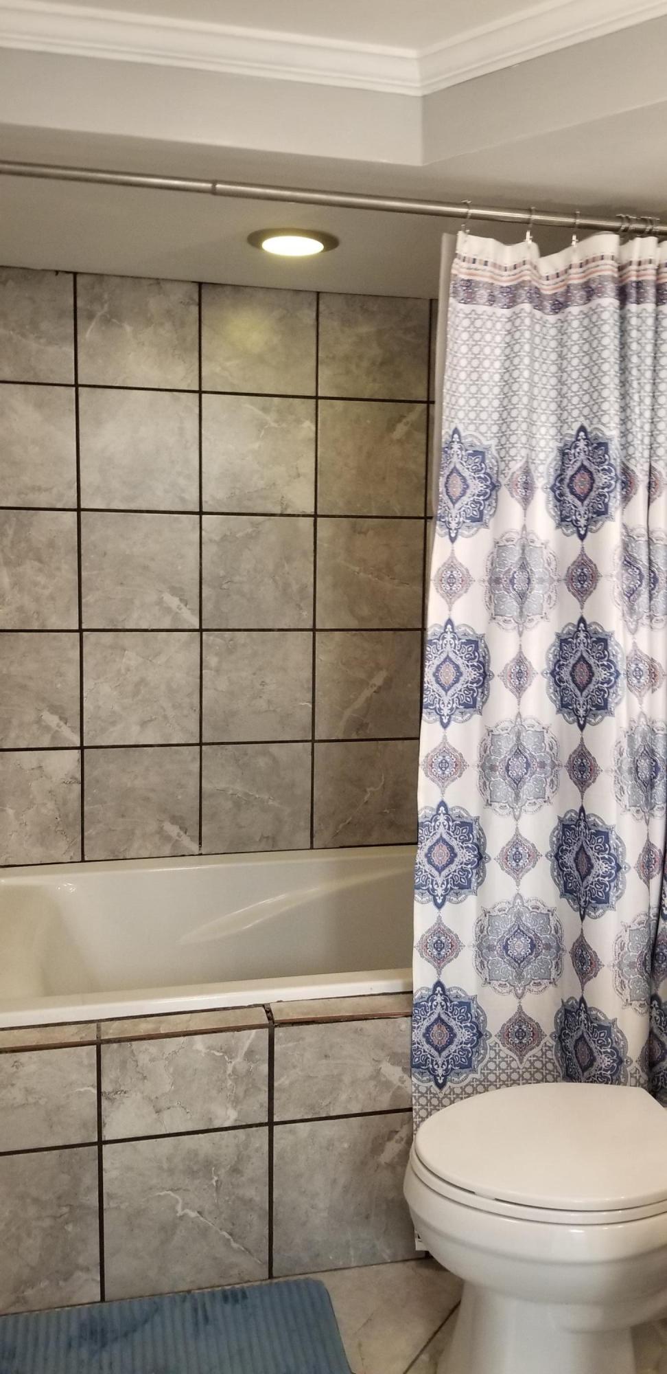 1317 Chandler Road Goodview, VA 24095 - Photo 22 of 29 a bathroom with a toilet and a shower