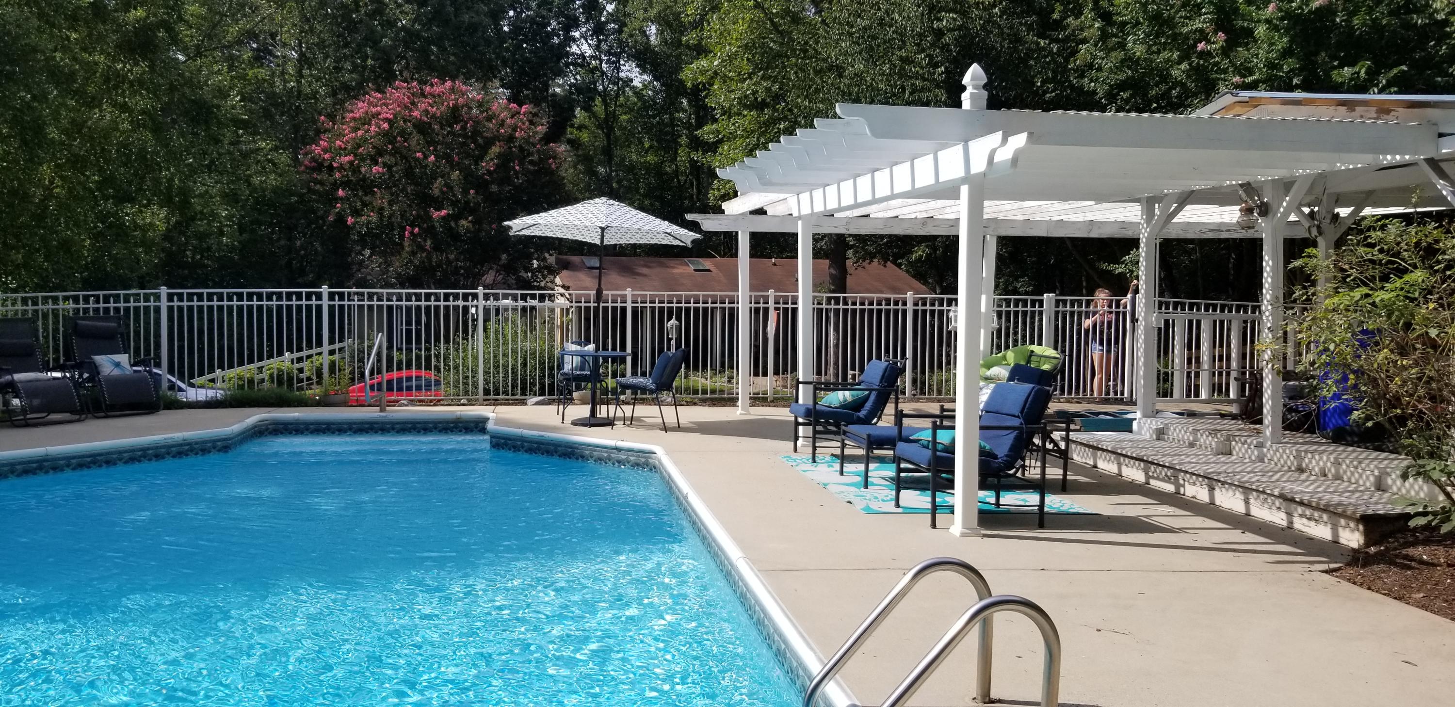 1317 Chandler Road Goodview, VA 24095 - Photo 26 of 29 a backyard of a house with table and chairs