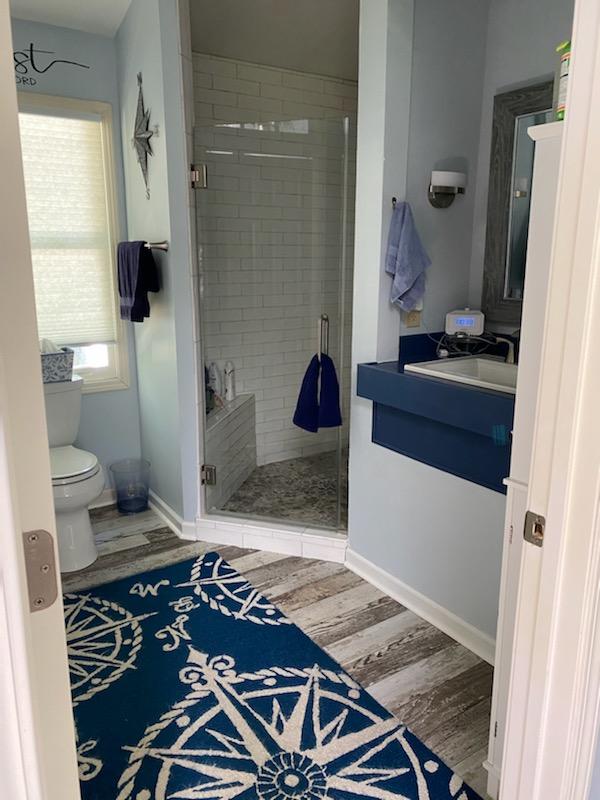 1317 Chandler Road Goodview, VA 24095 - Photo 10 of 29 a bathroom with a granite countertop sink and a mirror