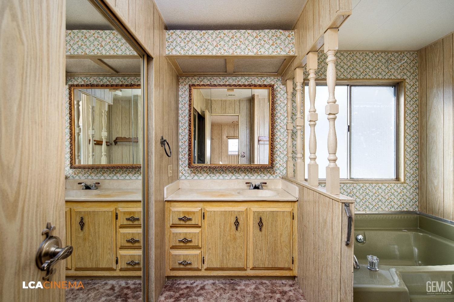 Undisclosed Address Onyx, CA 93255 - Photo 17 of 33 a bathroom with a granite countertop sink a mirror and a bathtub