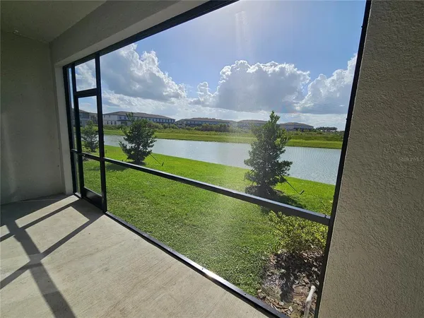 a view of a back yard from a balcony
