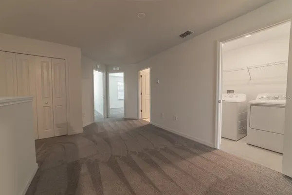 a view of a room with utility room and empty racks