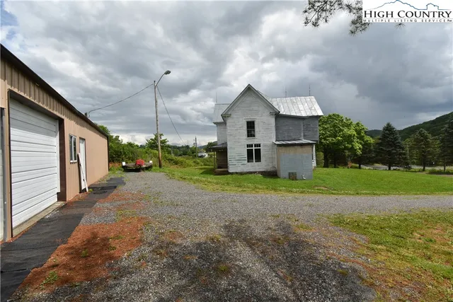 a view of a city with lush green forest