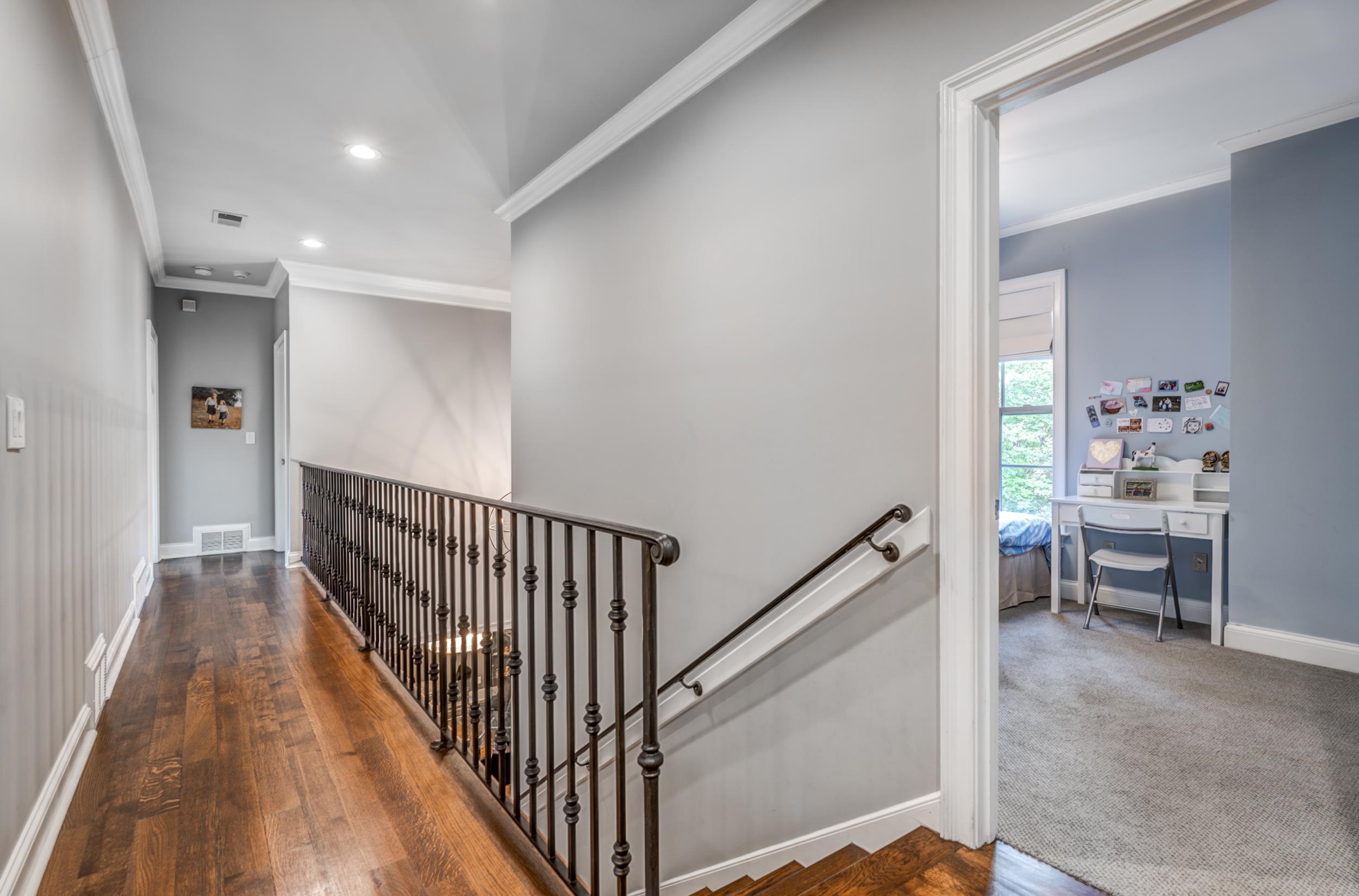 477 South Yates Road Memphis, TN 38120 - Photo 12 of 39 a view of a hallway with dining room and stairs