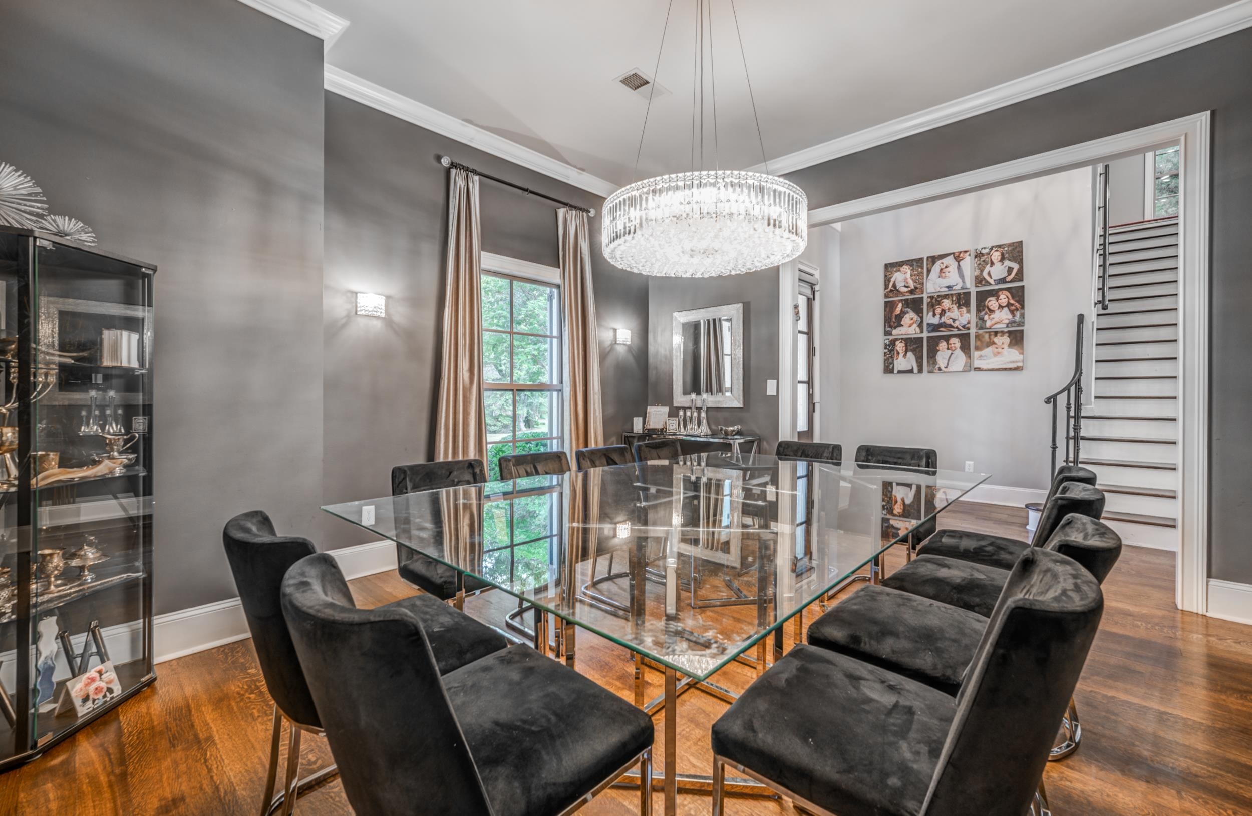 477 South Yates Road Memphis, TN 38120 - Photo 25 of 39 a view of a dining room with furniture wooden floor and chandelier