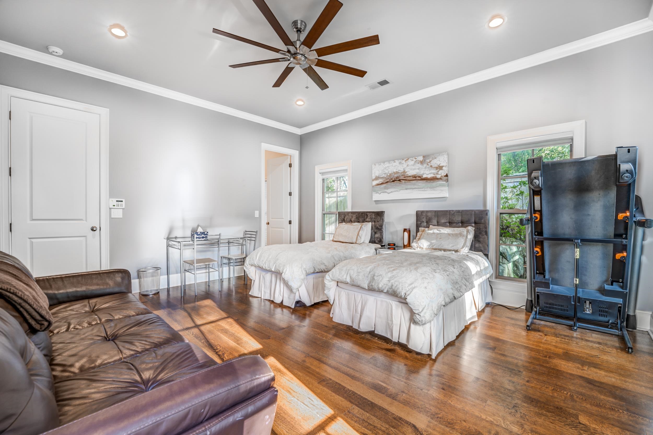 477 South Yates Road Memphis, TN 38120 - Photo 27 of 39 a bedroom with furniture and a flat screen tv