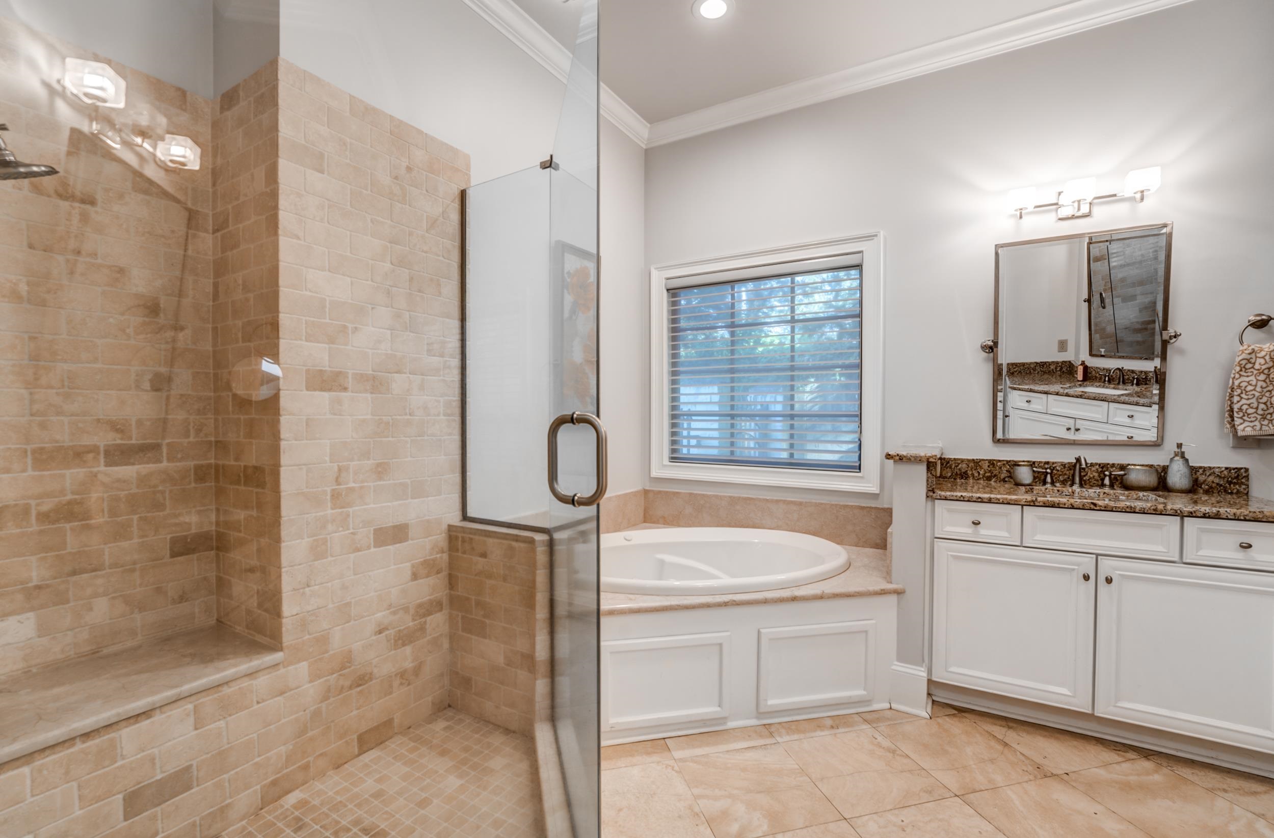 477 South Yates Road Memphis, TN 38120 - Photo 28 of 39 a bathroom with a sink a toilet a mirror and shower