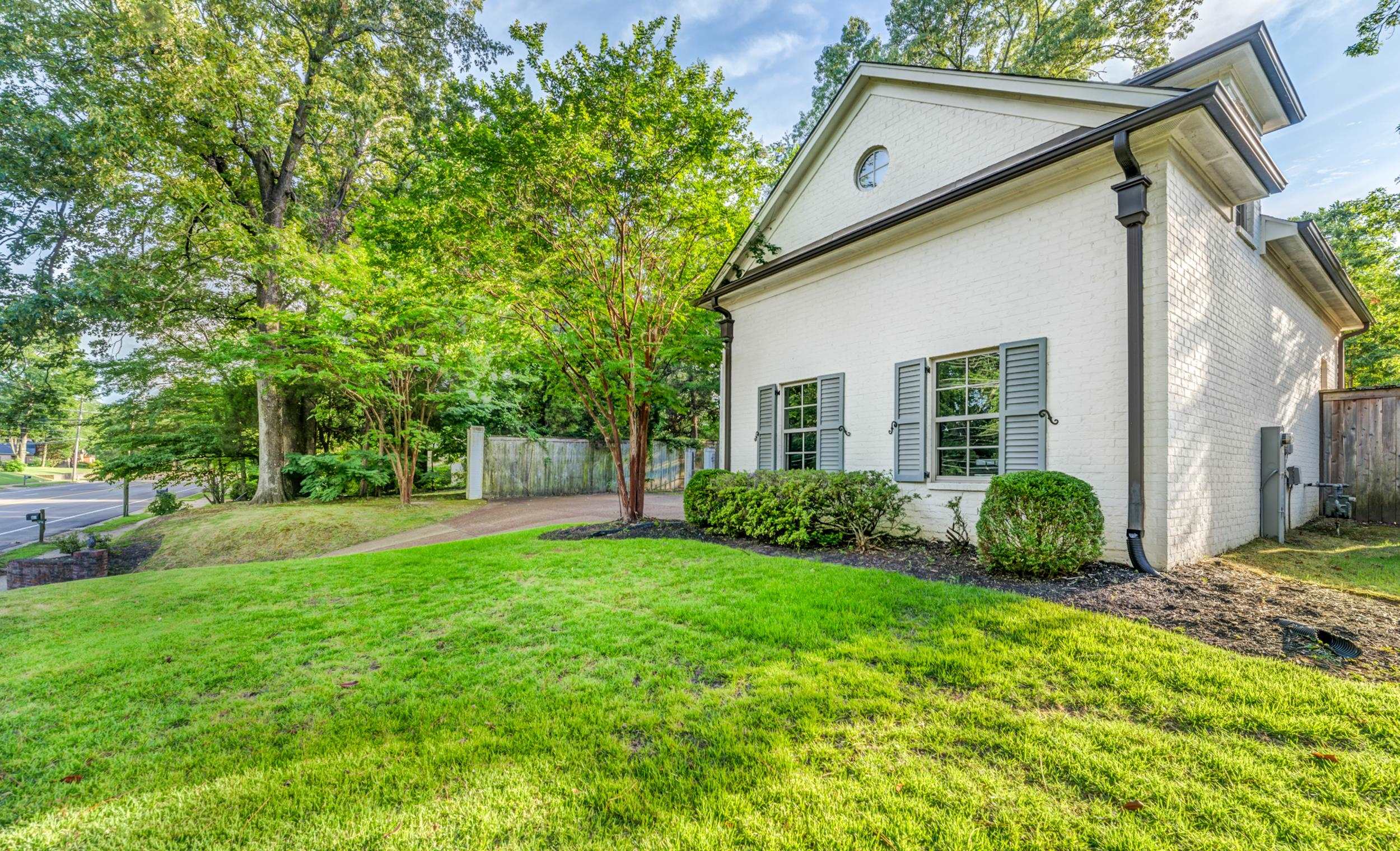 477 South Yates Road Memphis, TN 38120 - Photo 4 of 39 a view of a yard with a house and garden