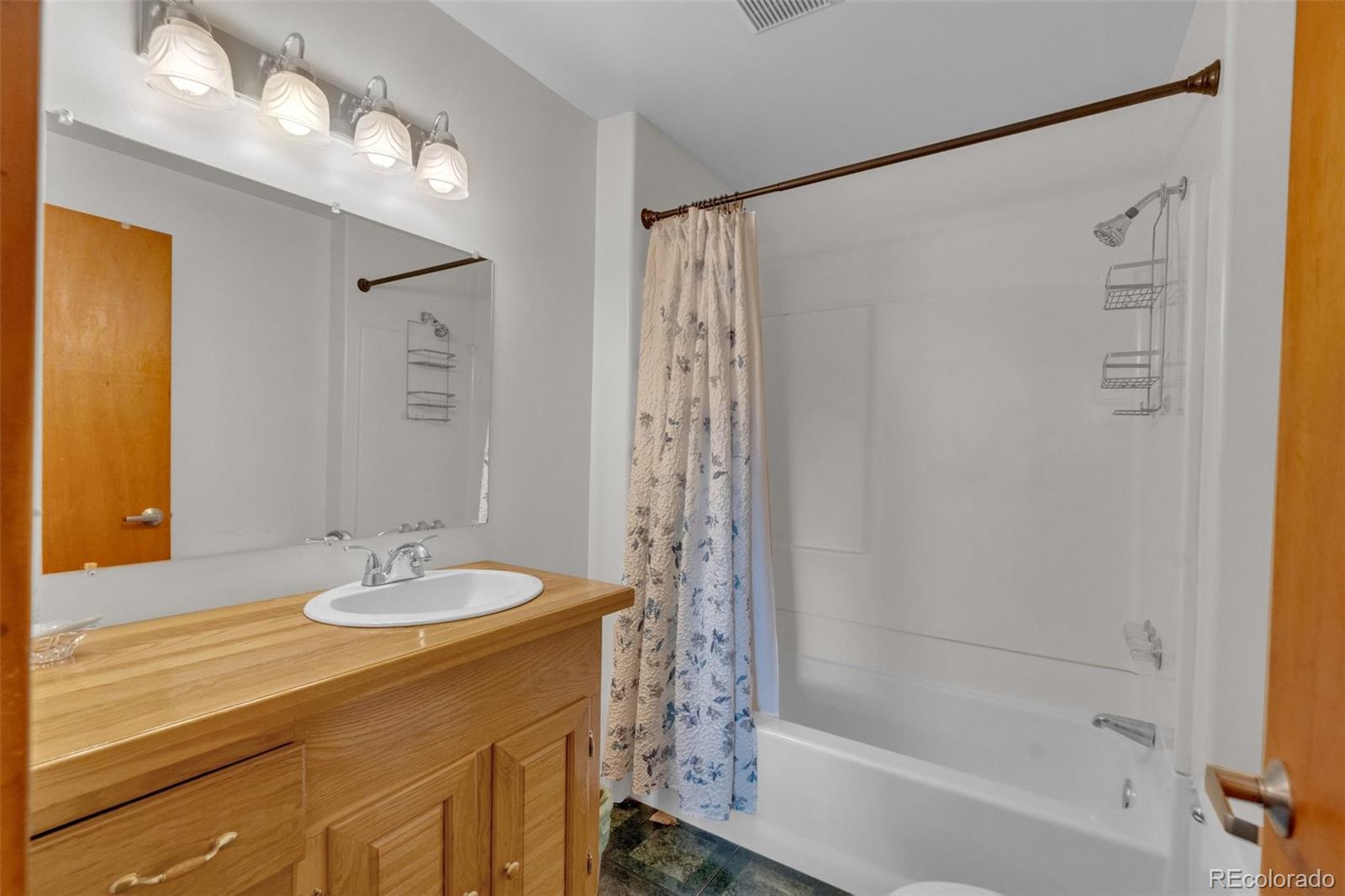 847 Timber Ridge Road Divide, CO 80814 - Photo 21 of 41 a bathroom with a sink and a mirror