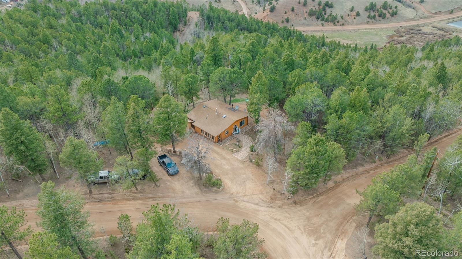 847 Timber Ridge Road Divide, CO 80814 - Photo 34 of 41 an aerial view of a house with a yard