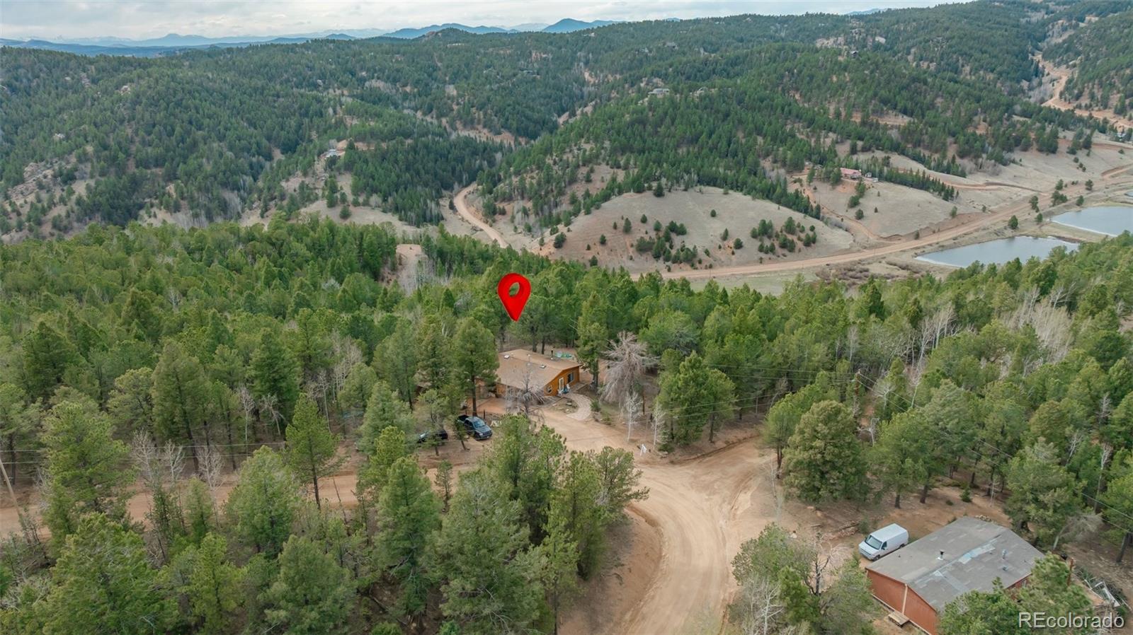 847 Timber Ridge Road Divide, CO 80814 - Photo 35 of 41 an aerial view of a house with a yard