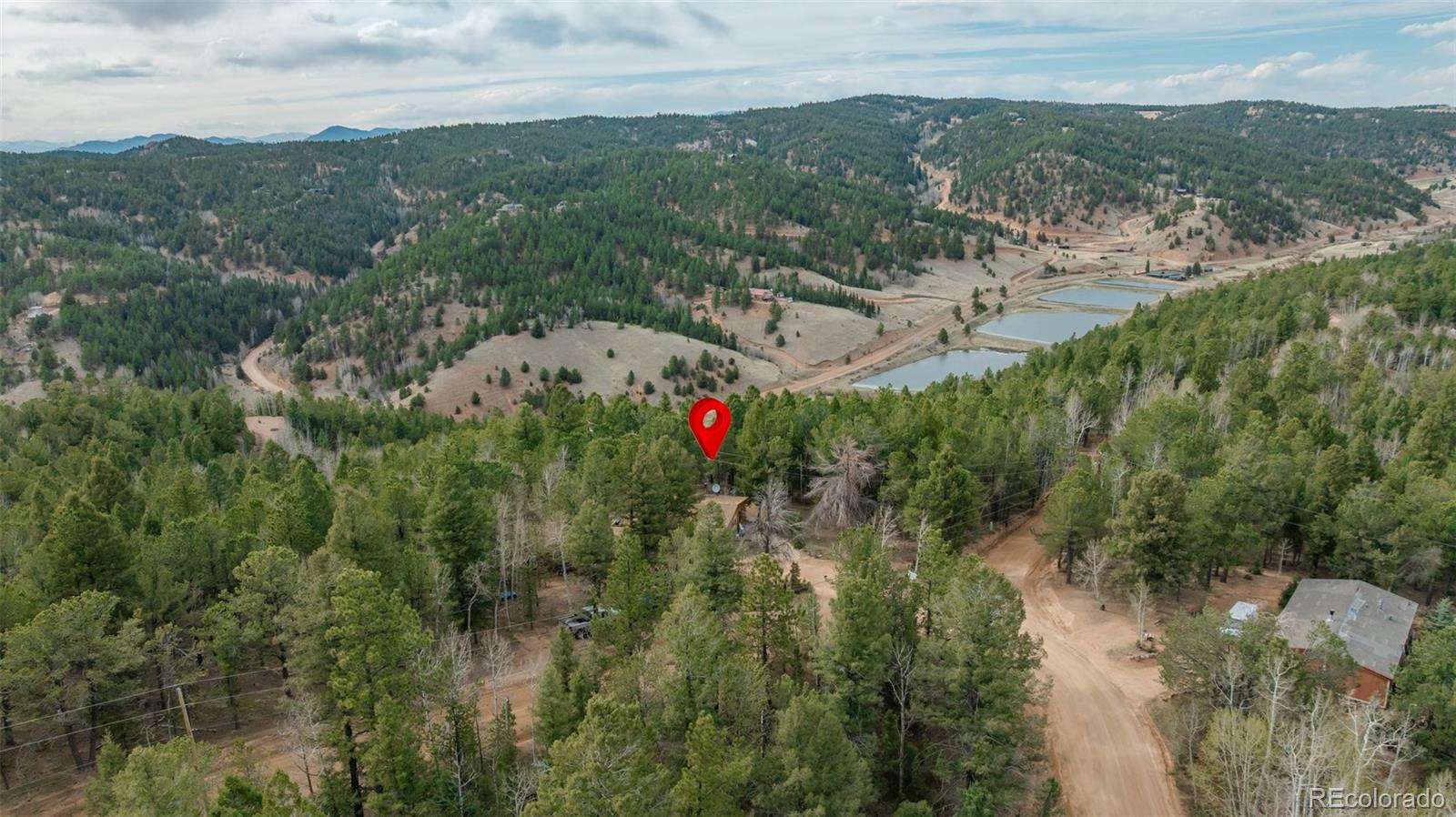 847 Timber Ridge Road Divide, CO 80814 - Photo 36 of 41 a view of a city with lush green forest