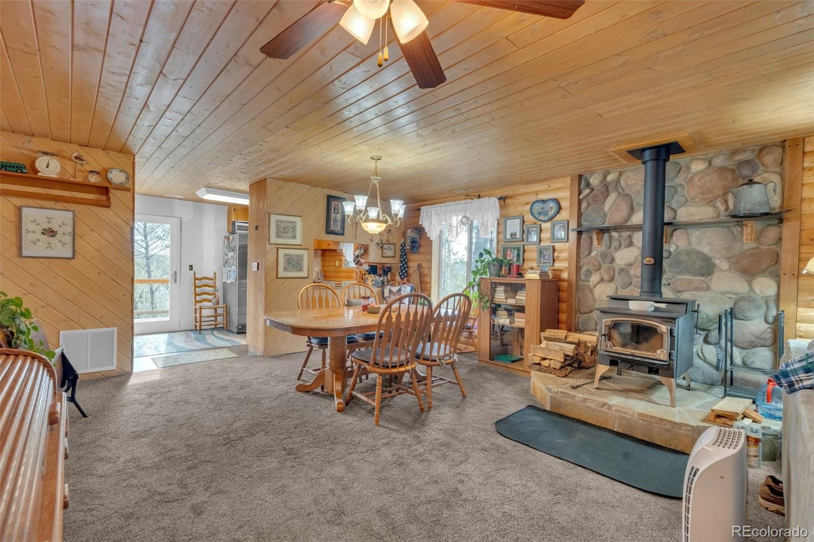 847 Timber Ridge Road Divide, CO 80814 - Photo 9 of 41 a living room with furniture and a table